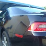 Photographs of a 2014 Chevrolet Camaro that was in an accident and repaired by Elite Paint & Body Shop in West Palm Beach Florida